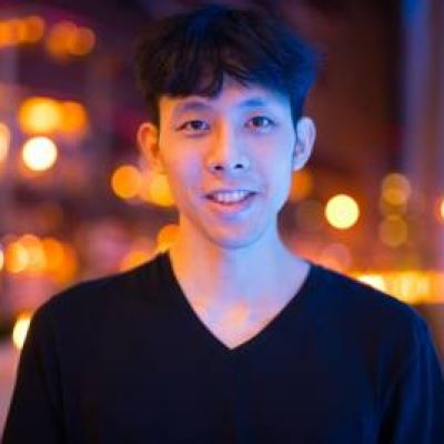 portrait-of-asian-man-smiling-outdoors-at-night